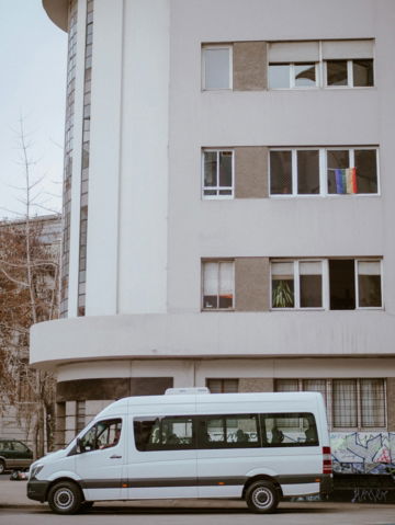 white van parking near building